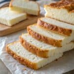 How to Make Cottage Cheese Cloud Bread (Fluffy, Healthy & Delicious Guide) 9 fluffy cottage cheese cloud bread slices on parchment paper